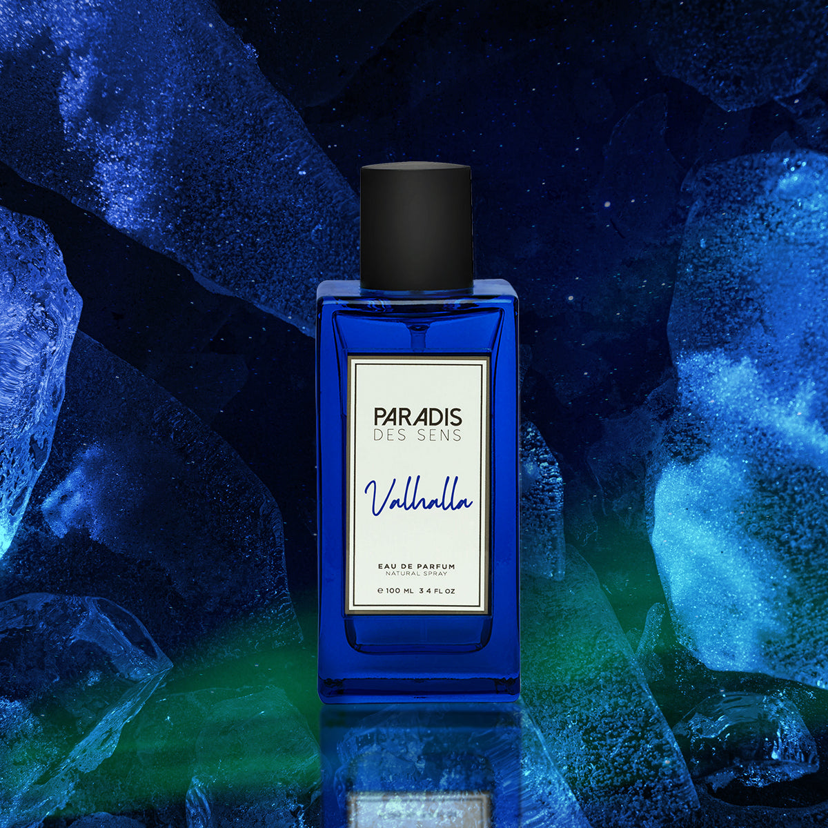 A blue glass bottle of Paradis des Sens Valhalla Eau de Parfum stands upright against a dramatic background of icy blue and green hues, evoking a cool, mystical atmosphere.