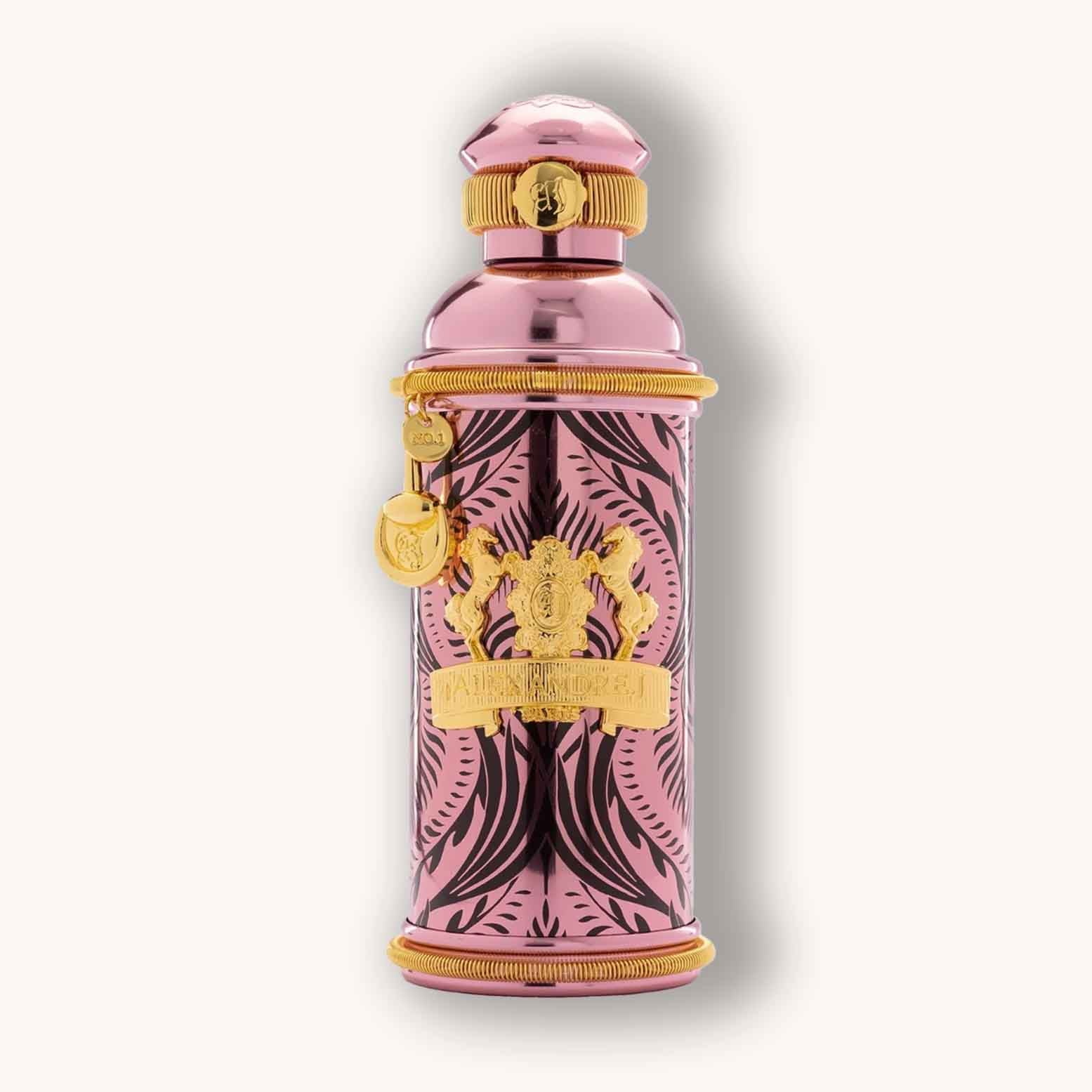 Alt text: A luxurious pink perfume bottle featuring intricate black designs, labeled "Alexandre. J Morning Muscs" with a decorative golden emblem and cap.