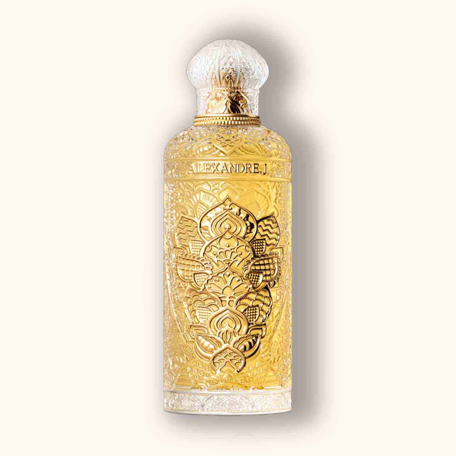 Alt text: A beautifully ornate bottle of Alexandre.J Gold Ode to Rose, featuring intricate floral engravings and a golden hue. The design reflects elegance and luxury, making it a stunning addition to any fragrance collection.