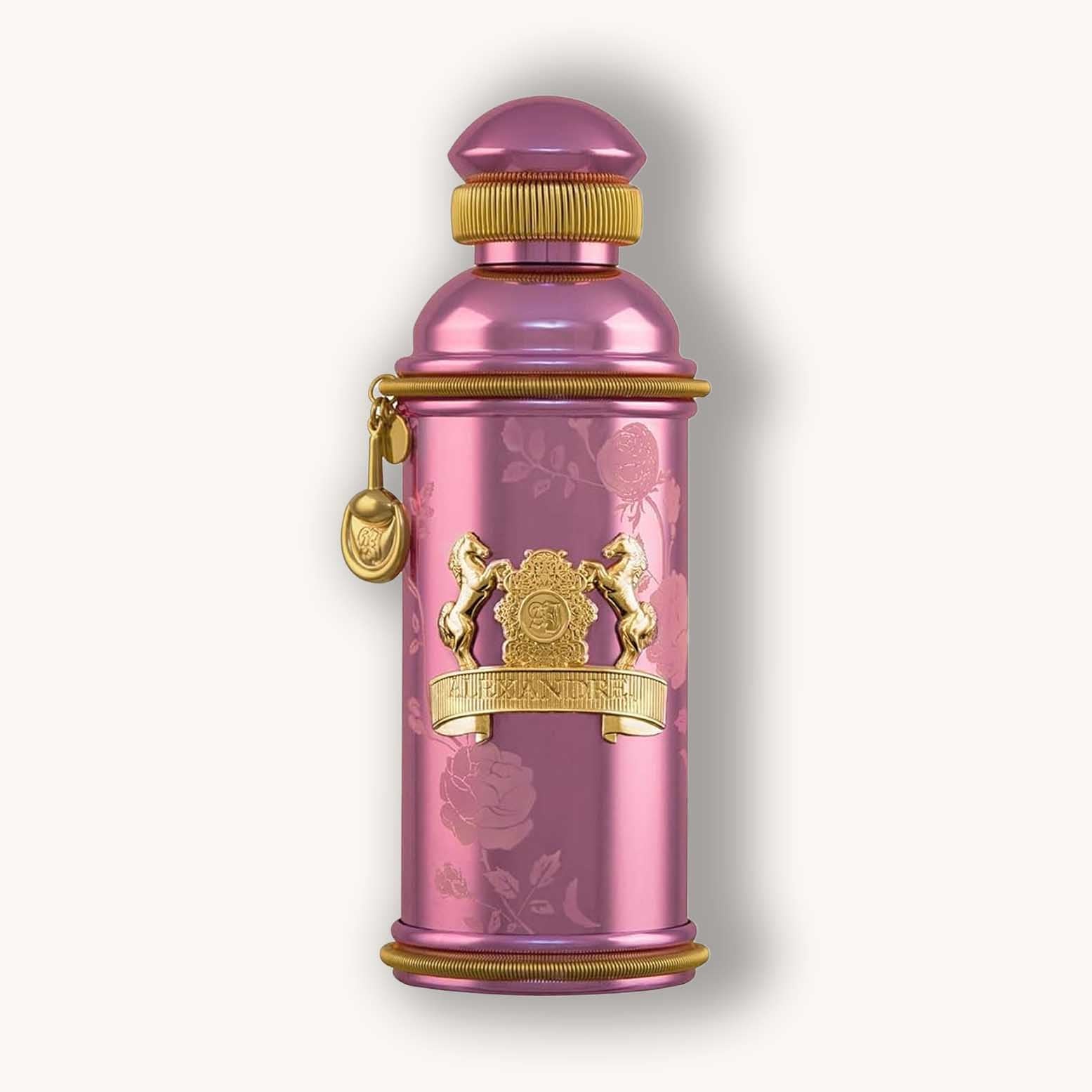 Alt text: A luxurious bottle of Alexandre.J Rose Oud fragrance, featuring a sleek pink design with intricate floral patterns and ornate gold detailing. The cap is stylized and accentuates the elegant presentation of the perfume.