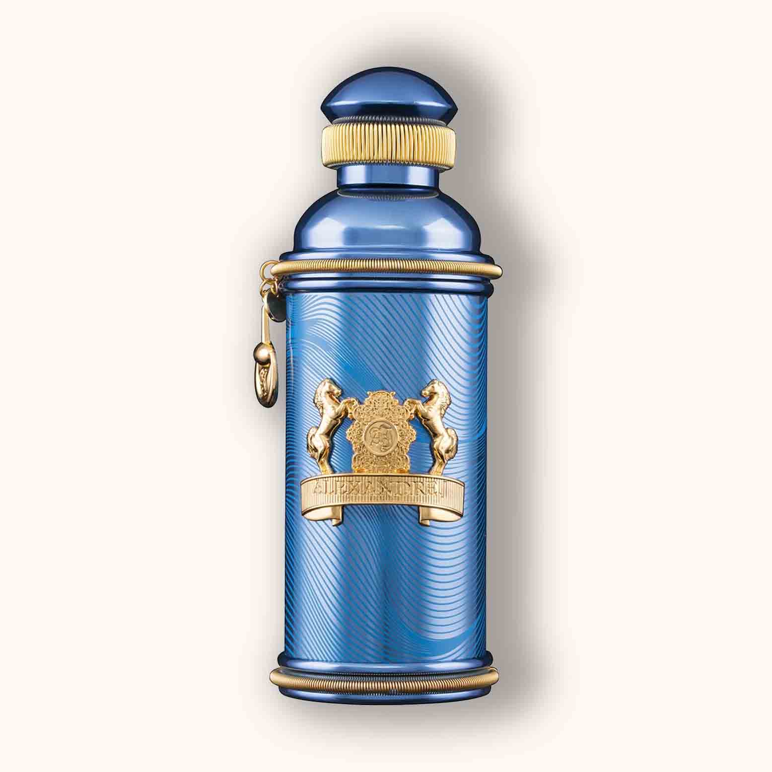 Alt text: A luxurious bottle of Alexandre.J Zafeer Oud Vanille, featuring a striking blue design with ornate gold accents and a decorative charm.