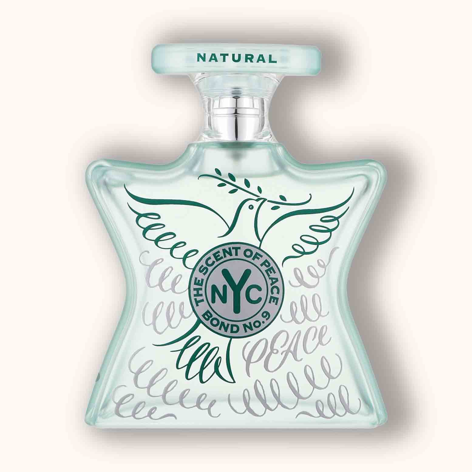 Alt text: "Bond No.9 The Scent Of Peace Natural is displayed in a star-shaped bottle featuring a soft blue top and intricate designs, including a dove and the word 'PEACE' in elegant script."
