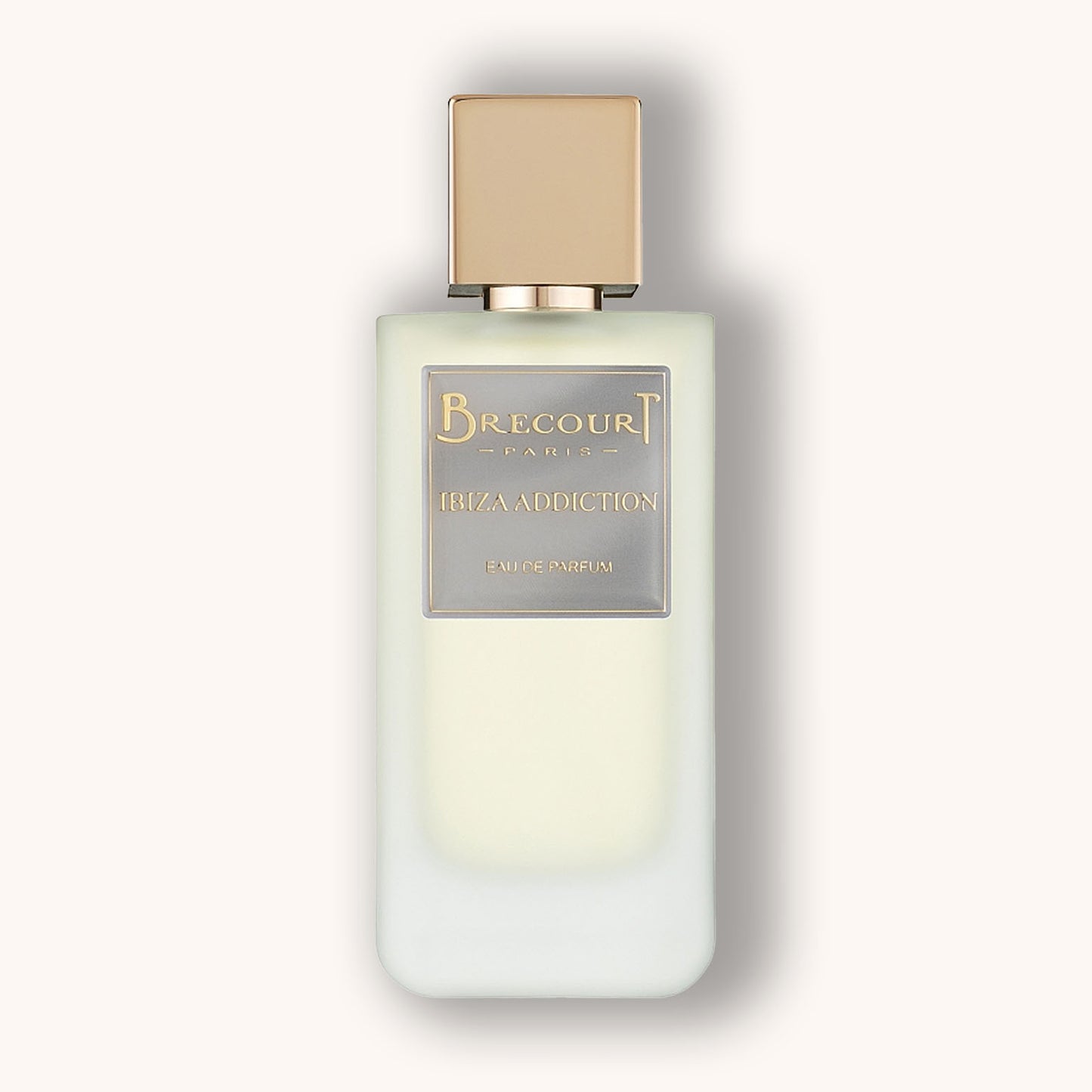 A sleek white perfume bottle with a gold cap featuring the label "Brecourt Ibiza Addiction." The elegant design reflects a luxurious fragrance experience.