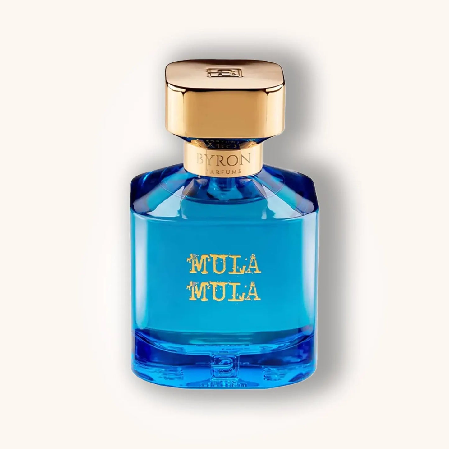 Byron Mula Mula perfume bottle – vibrant blue fragrance bottle with gold cap and lettering, niche luxury perfume.
