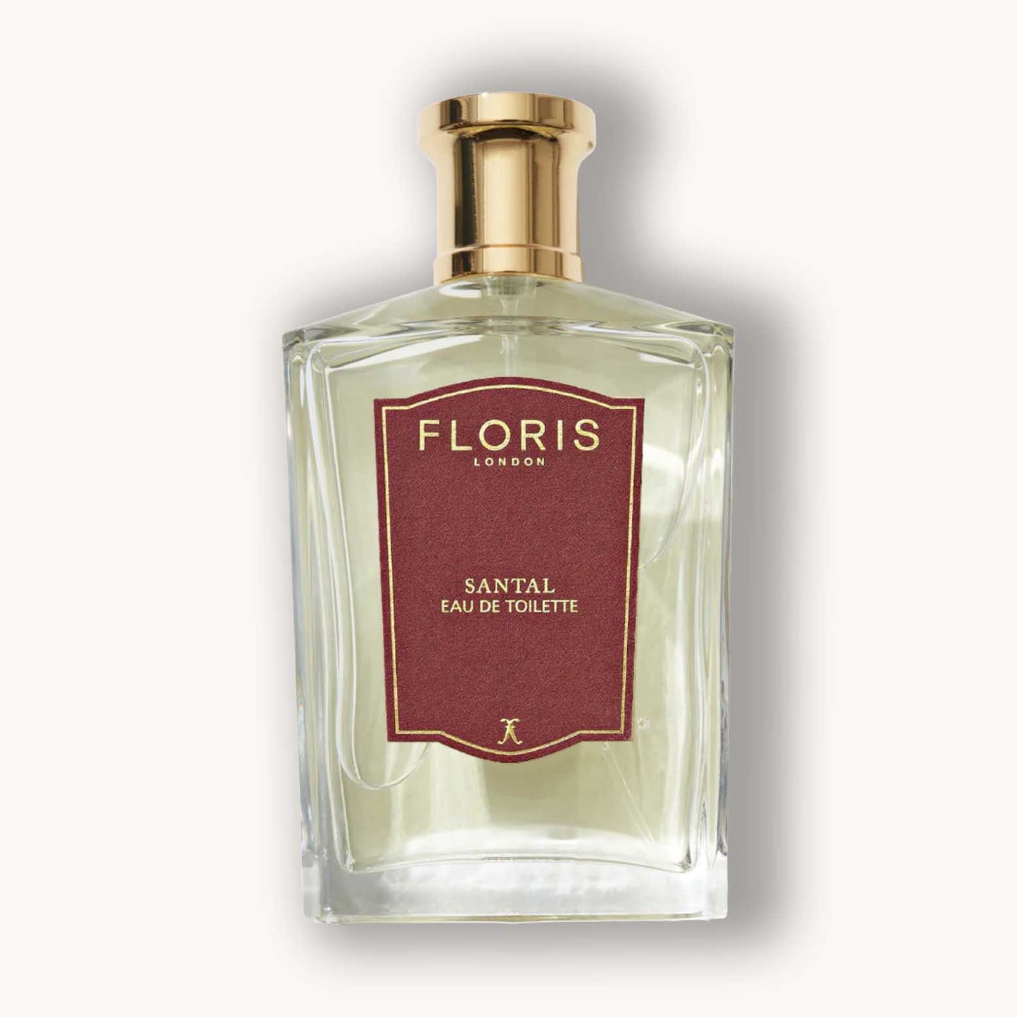 A glass bottle of Floris London Santal Eau de Toilette, featuring a classic design with a gold cap and a rich maroon label. The fragrance exudes a warm, woody aroma ideal for any occasion.