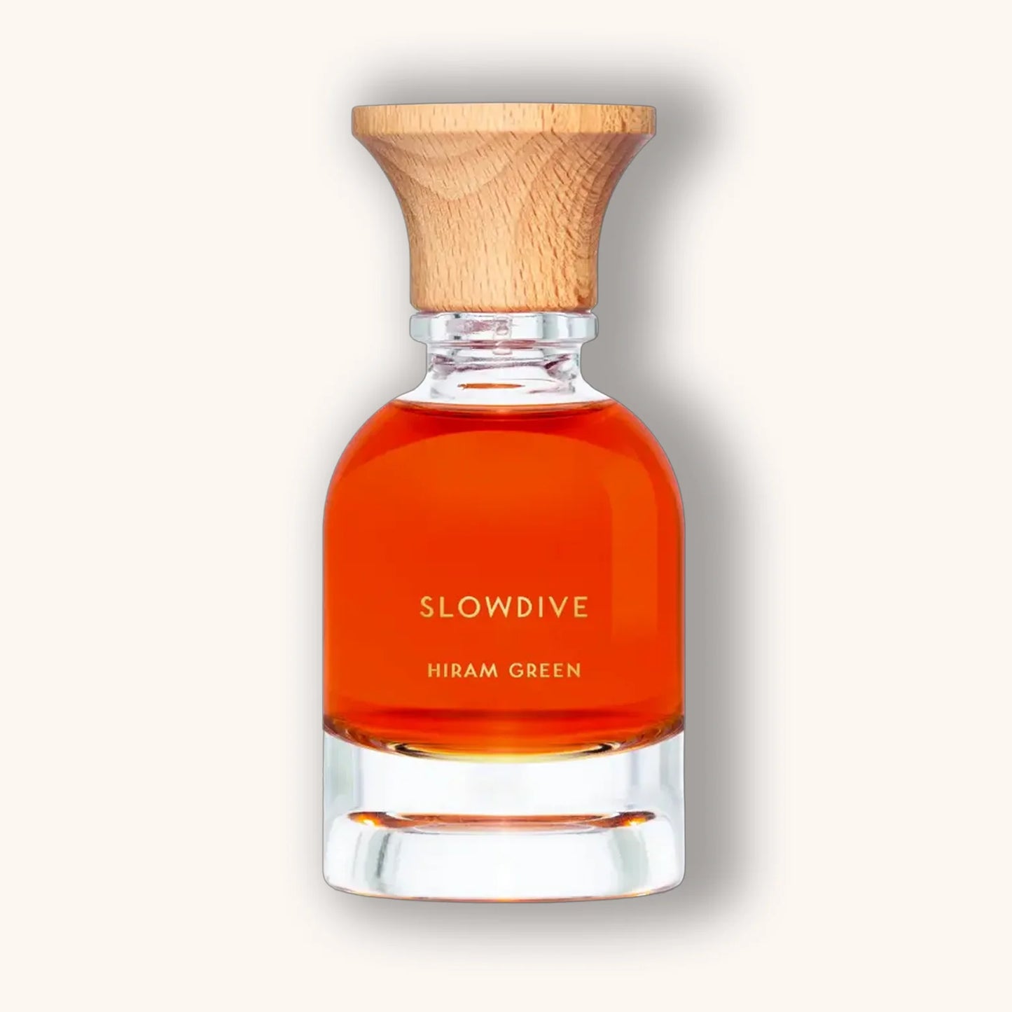Slowdive perfume by Hiram Green featuring rich amber-red liquid in an elegant glass flacon.