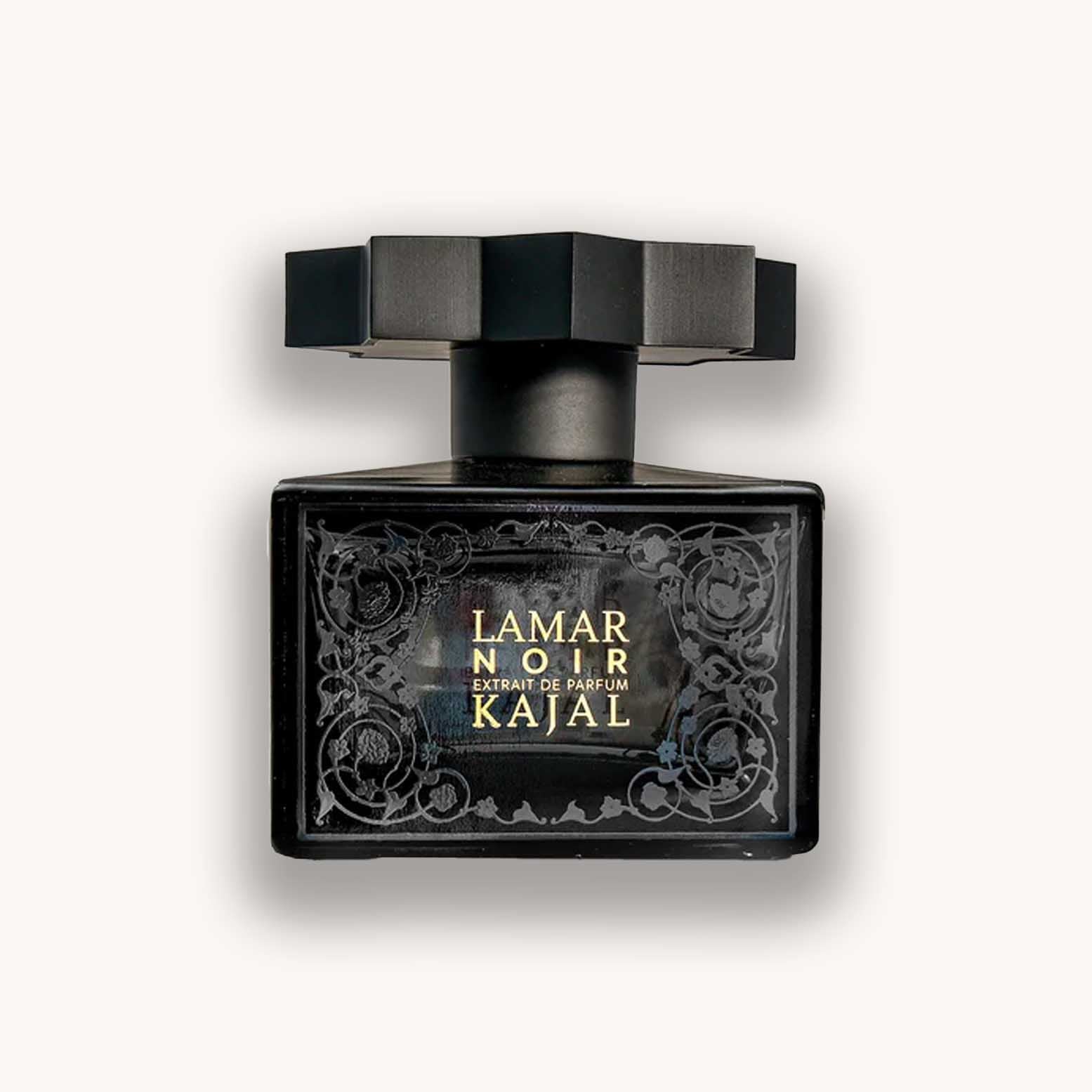 Alt text: A sleek black perfume bottle of 'Kajal Lamar Noir' featuring an ornate design and a distinctive octagonal cap. The elegant packaging highlights the luxurious and mysterious essence of the fragrance.