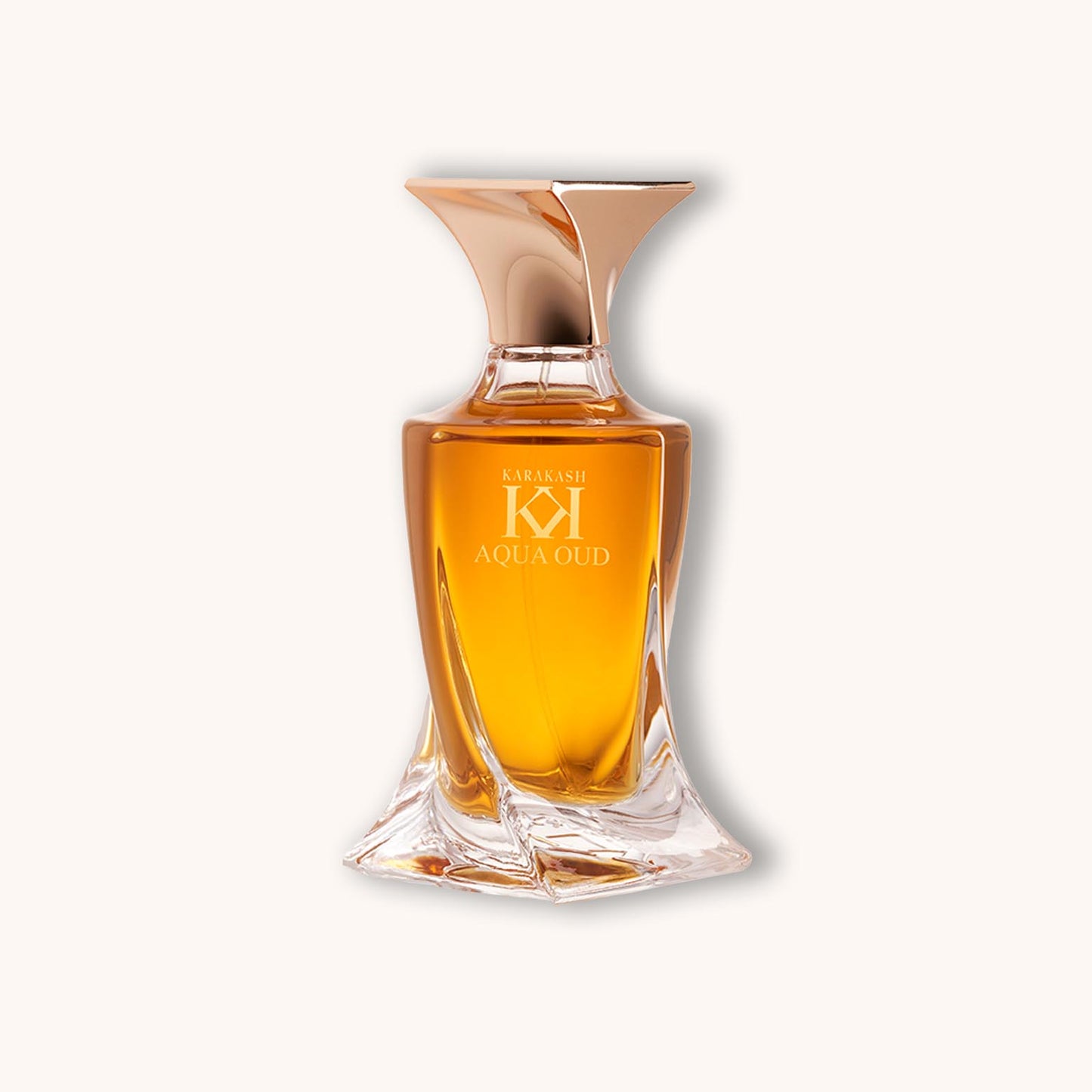 Alt text: A bottle of Karakash Perfume Aqua Oud, featuring an elegant design with a gold and clear glass finish, containing a warm amber liquid.