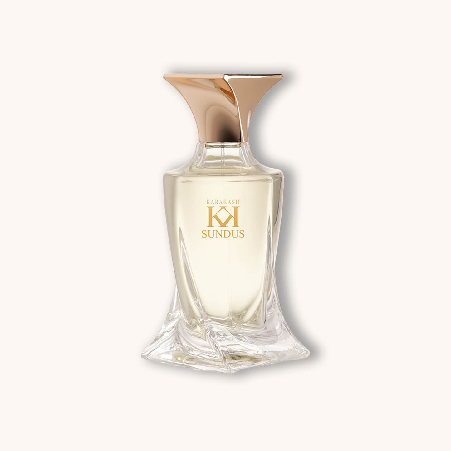 Alt text: A sleek, elegantly designed glass bottle of Karakash Sundus perfume, featuring a distinctive gold cap and a minimalist logo. The fragrance is light and inviting, displayed against a soft, neutral background.
