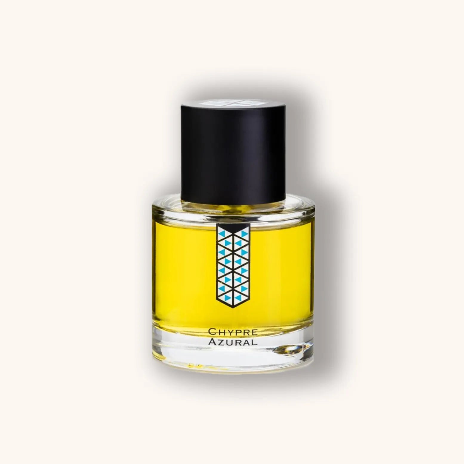 A sleek glass bottle of Les Indémodables Chypre Azural perfume, featuring a vibrant yellow fragrance and a striking geometric label design. The bottle is topped with a black cap, giving it an elegant and modern appearance.