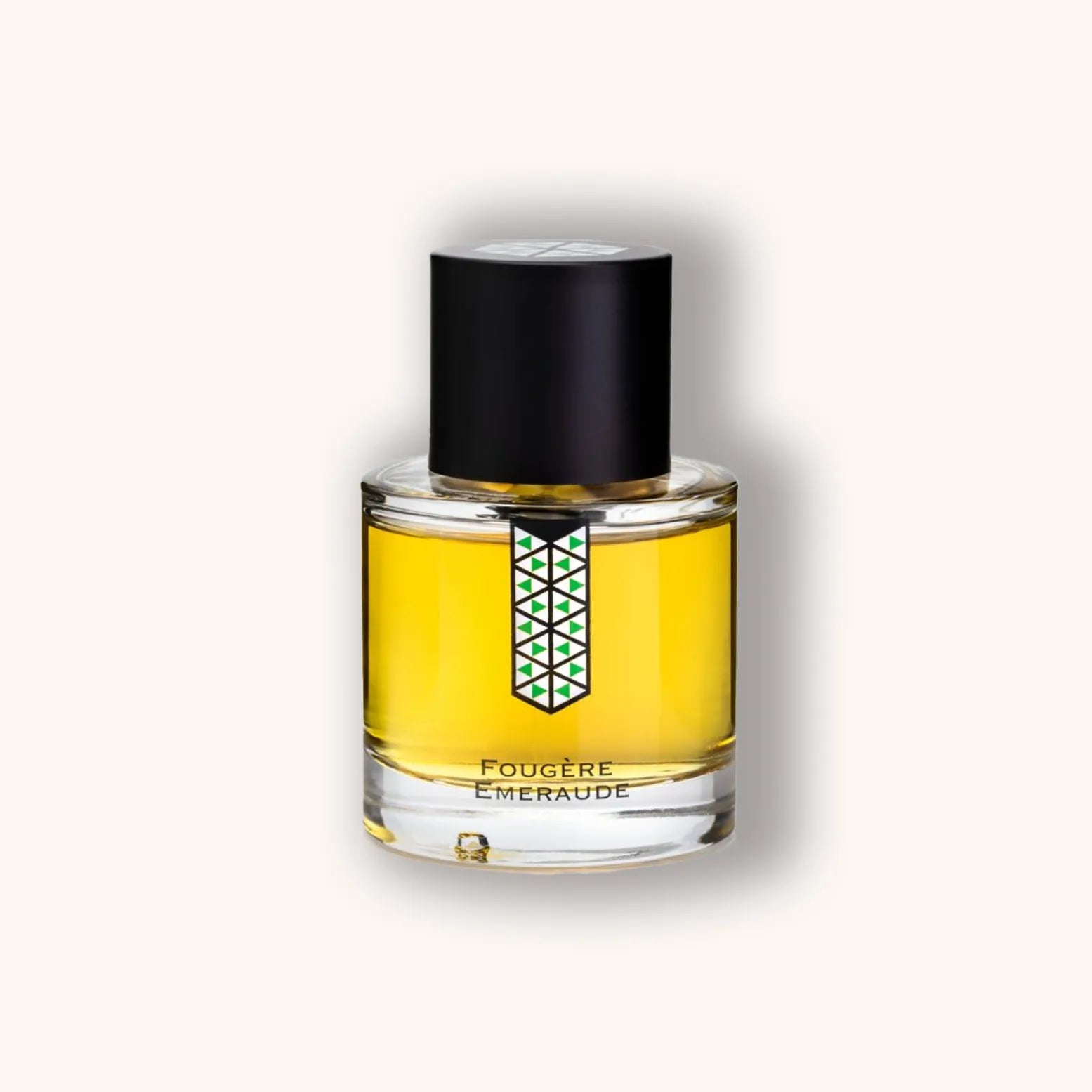 A bottle of 'Les Indémodables Fougere Emeraude' perfume, featuring a vibrant yellow liquid in a sleek glass container with a black cap and a geometric label design.