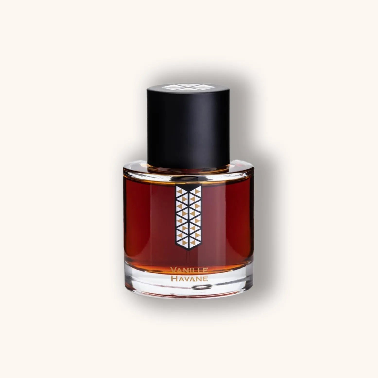 A stylish bottle of Les Indémodables Vanille Havane perfume, featuring a dark brown liquid and an elegant geometric design on the label. The bottle is topped with a sleek black cap, embodying a sophisticated fragrance experience.