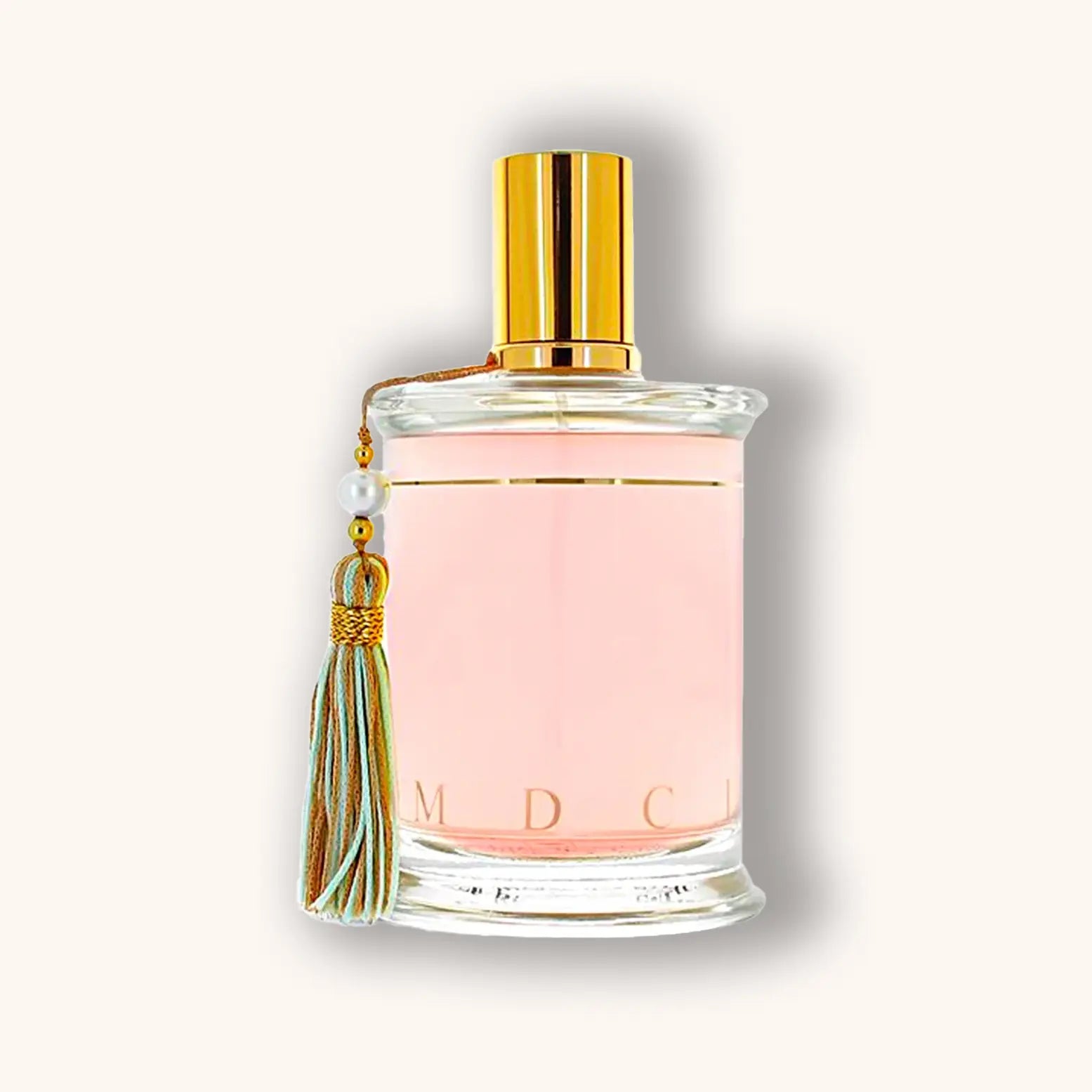 Bottle of MDCI Cio Cio San perfume in soft pink, accented by a pastel green tassel.
