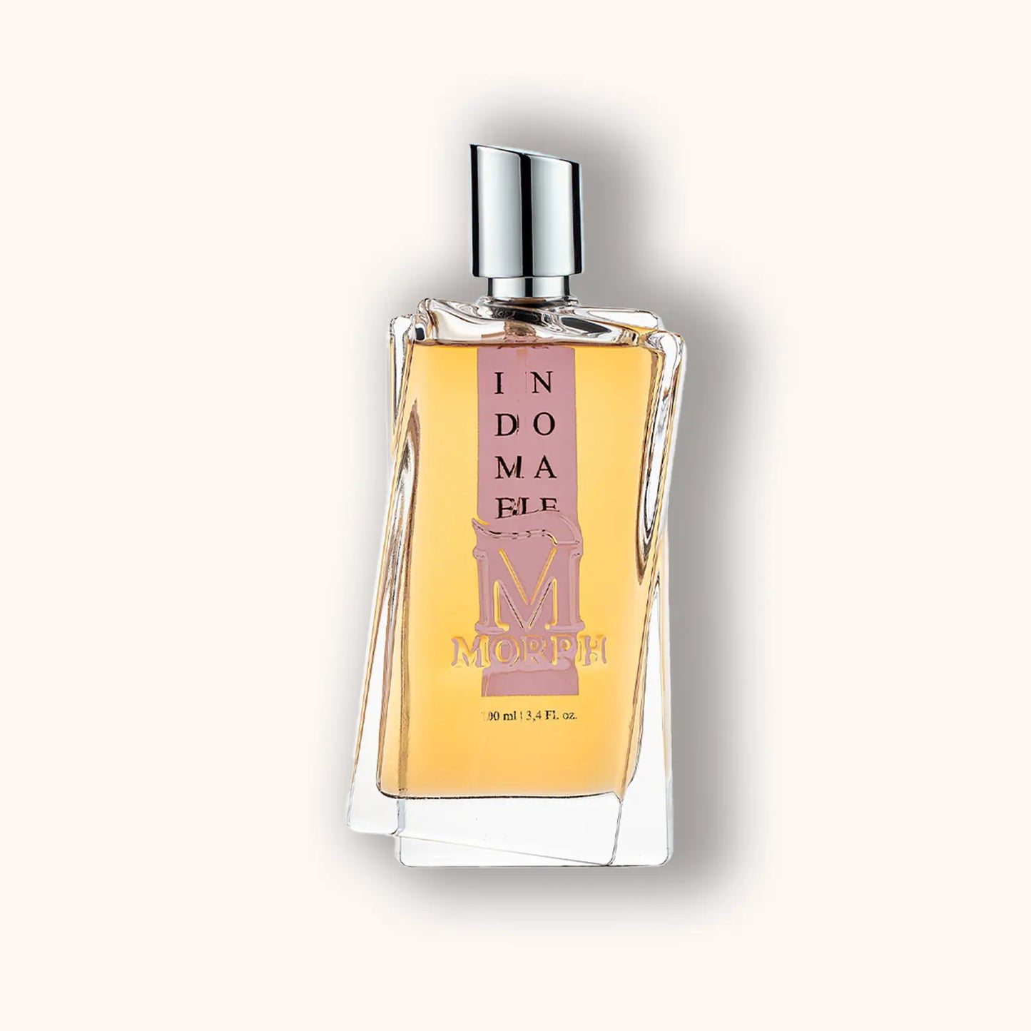 Alt text: A sleek, modern bottle of Morph Indomable perfume, featuring a distinctive shape and elegant label, filled with amber-colored fragrance. The bottle is 90 ml (3.4 fl oz).