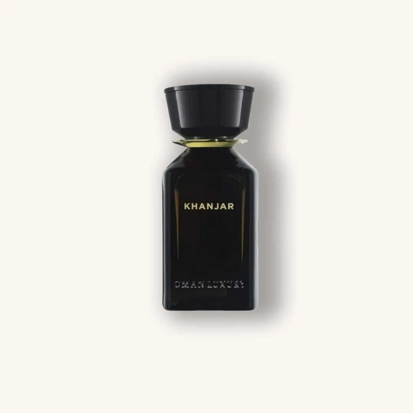Alt text: A sleek black bottle of Omanluxury Khanjar fragrance, featuring elegant gold lettering on a minimalist design, symbolizing luxury and sophistication.