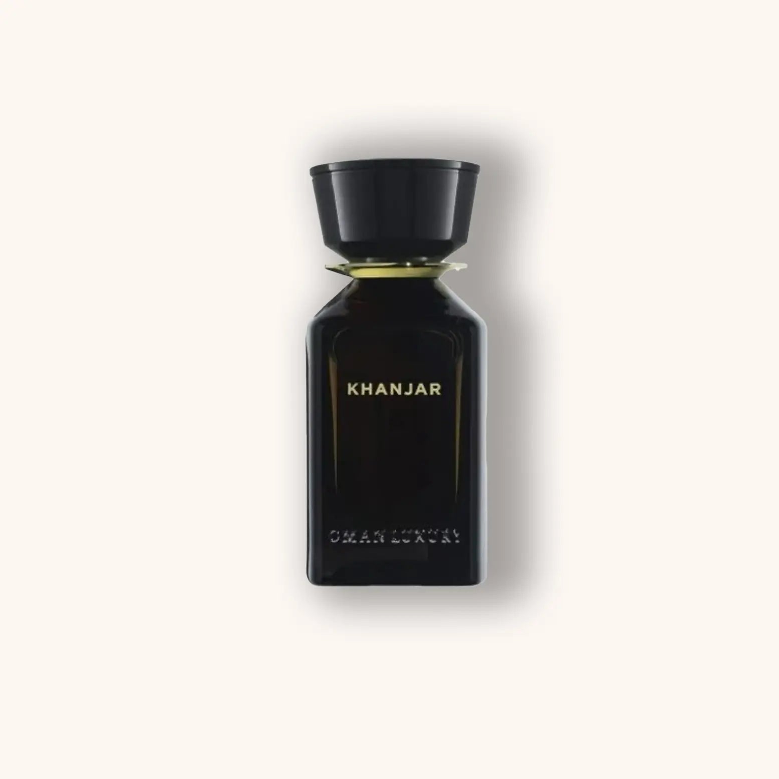 Alt text: A sleek black bottle of Omanluxury Khanjar fragrance, featuring elegant gold lettering on a minimalist design, symbolizing luxury and sophistication.