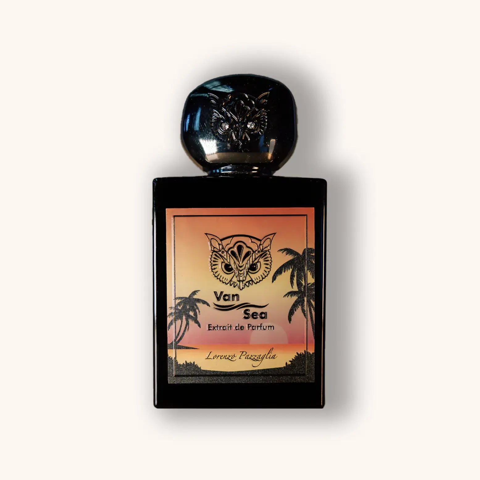 A sleek black perfume bottle with a decorative cap, featuring a vibrant sunset design and palm trees on the label. The label reads "Van Sea" and "Lorenzo Pazzaglia," indicating it's an extrait de parfum.