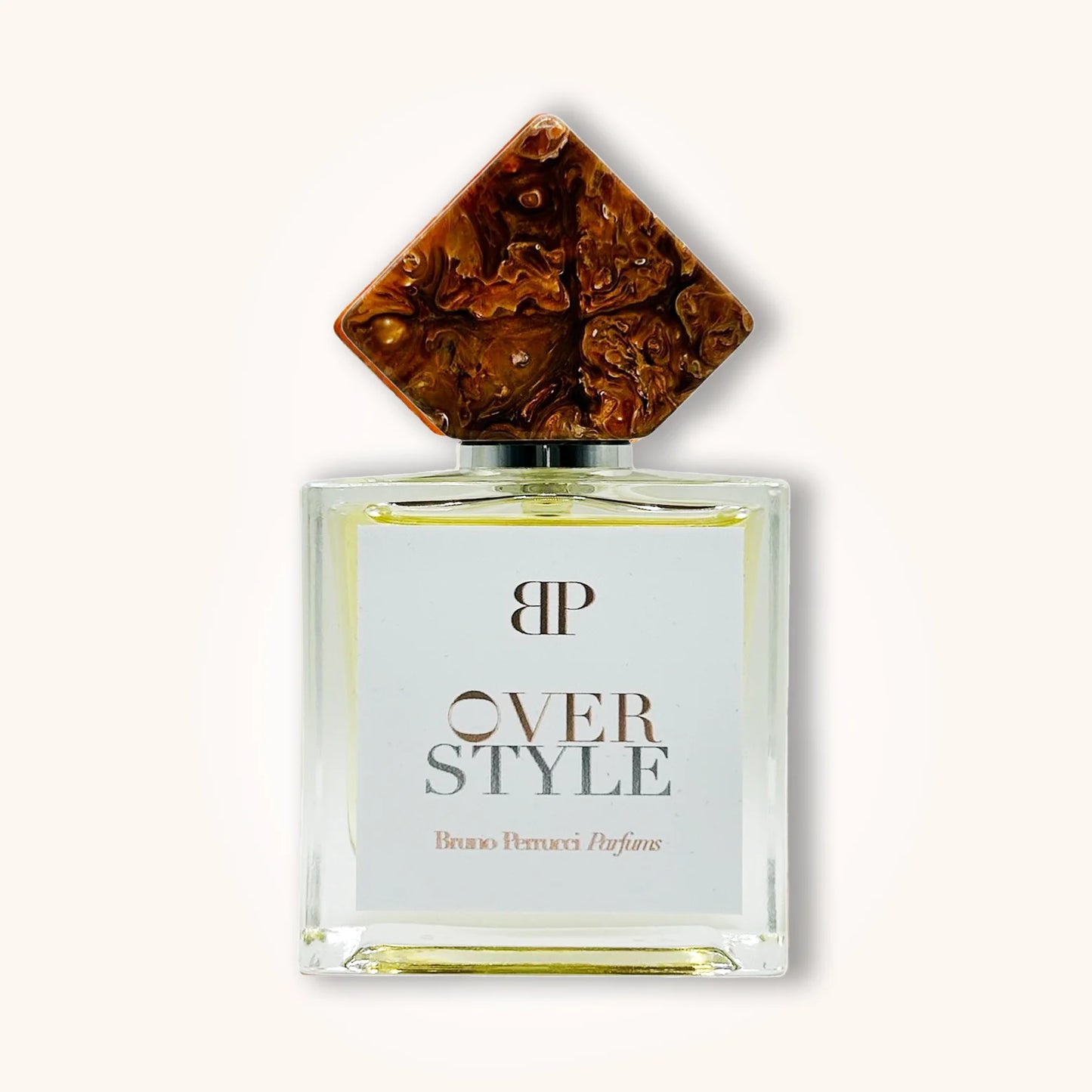Bruno Perrucci Over Style perfume in a rectangular glass bottle with white label and a unique marbled brown diamond-shaped cap.