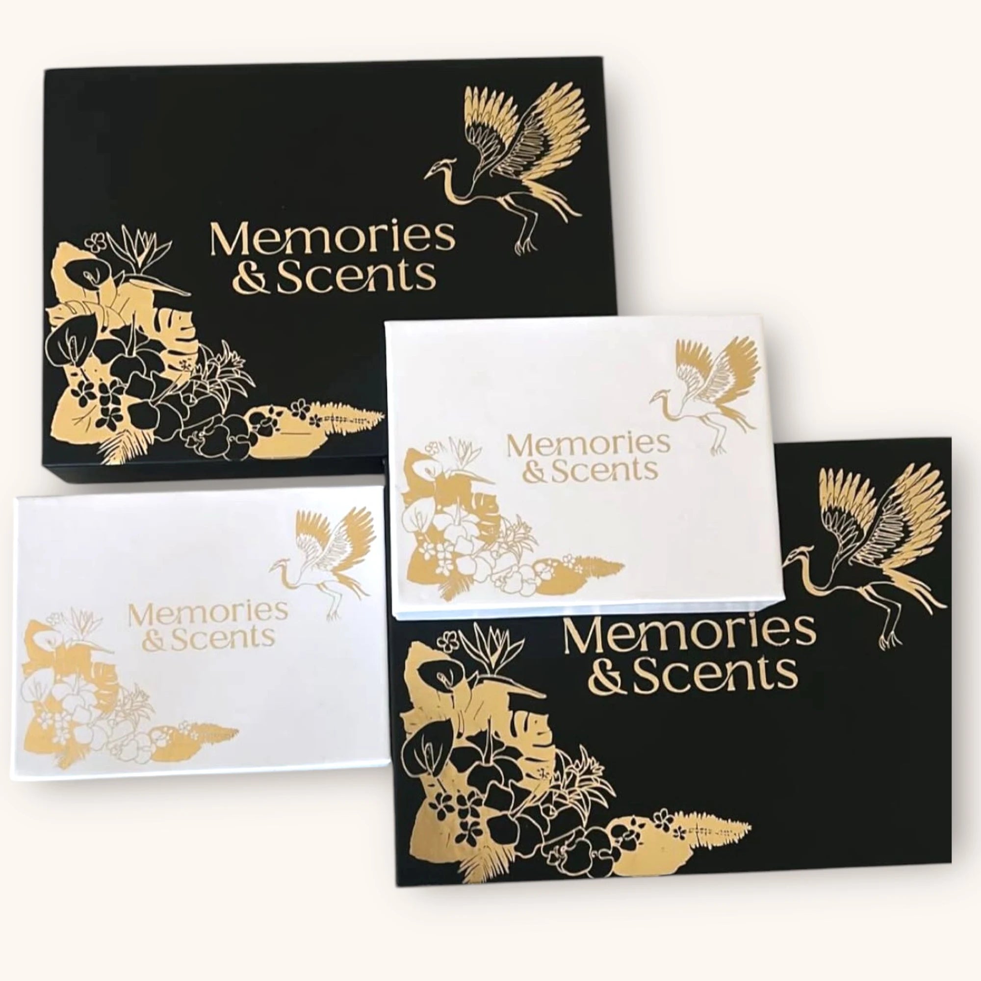 Set of 'Memories & Scents' packaging with gold and white designs on a white background. Luxury packing for the 2ML sample box and 8ML Gift box