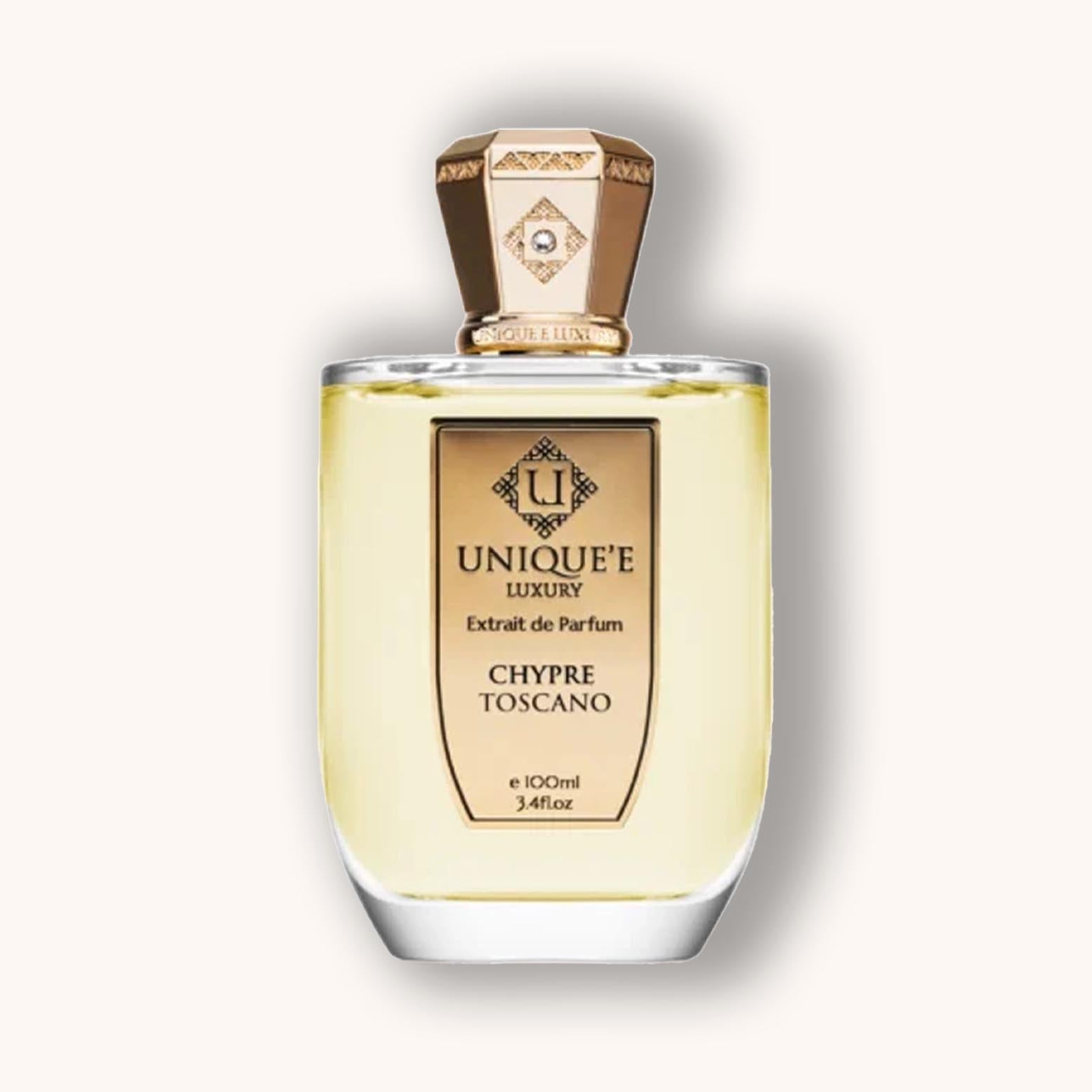 Alt tag: A sleek, elegant bottle of Unique'e Luxury Chypre Toscano perfume, featuring a gold and glass design. The bottle contains 100ml of a rich, sophisticated fragrance.