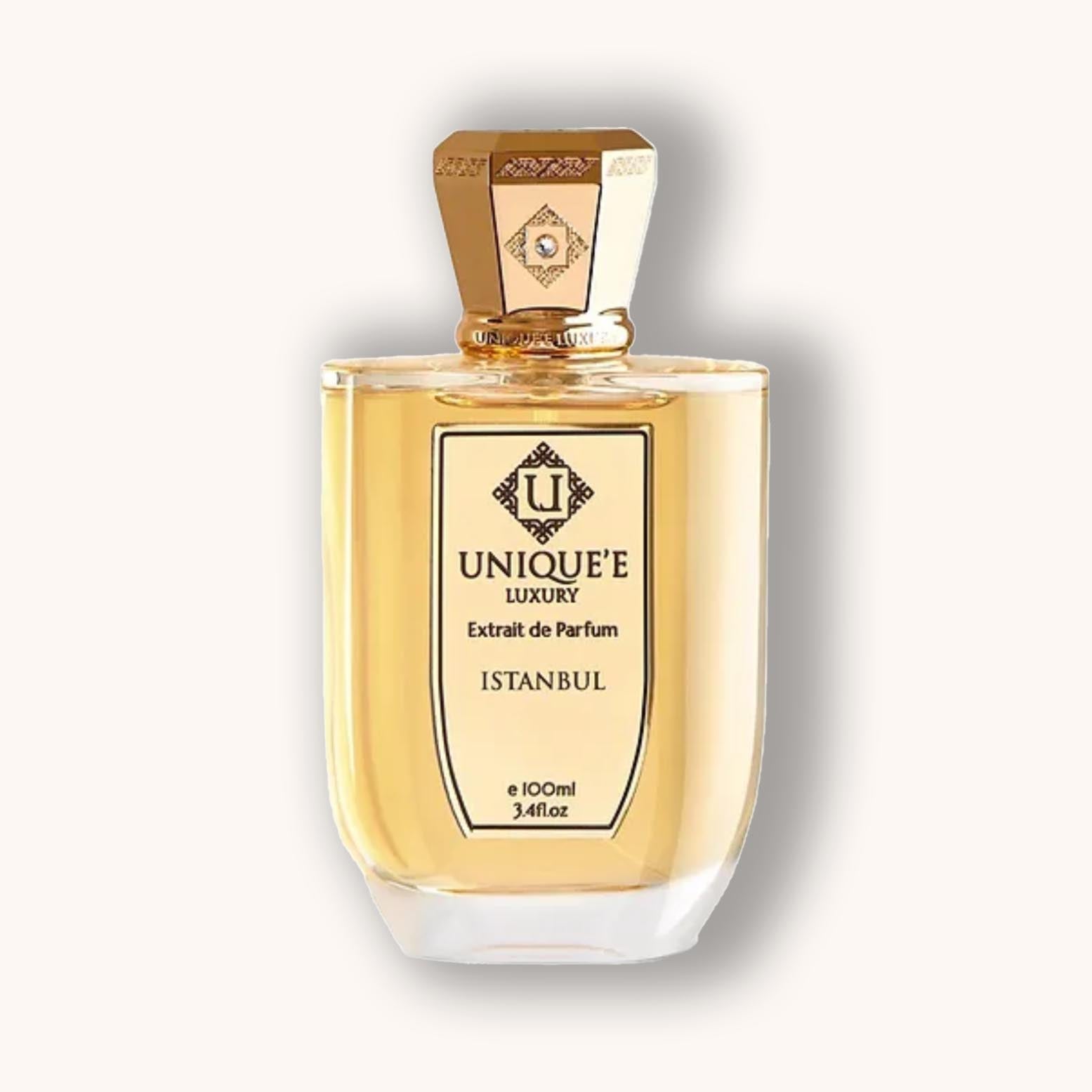 Alt text: A luxurious perfume bottle from Unique'e Luxury Istanbul, featuring a golden cap and elegant design, holding 100ml of exquisite fragrance.