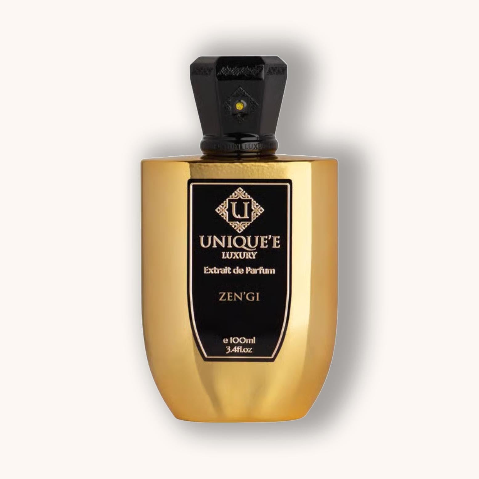 Alt text: A luxurious golden perfume bottle labeled 'Unique'e Luxury Zen'gi,' featuring an elegant design and a decorative cap. The bottle contains 100ml of extrait de parfum, exuding sophistication.
