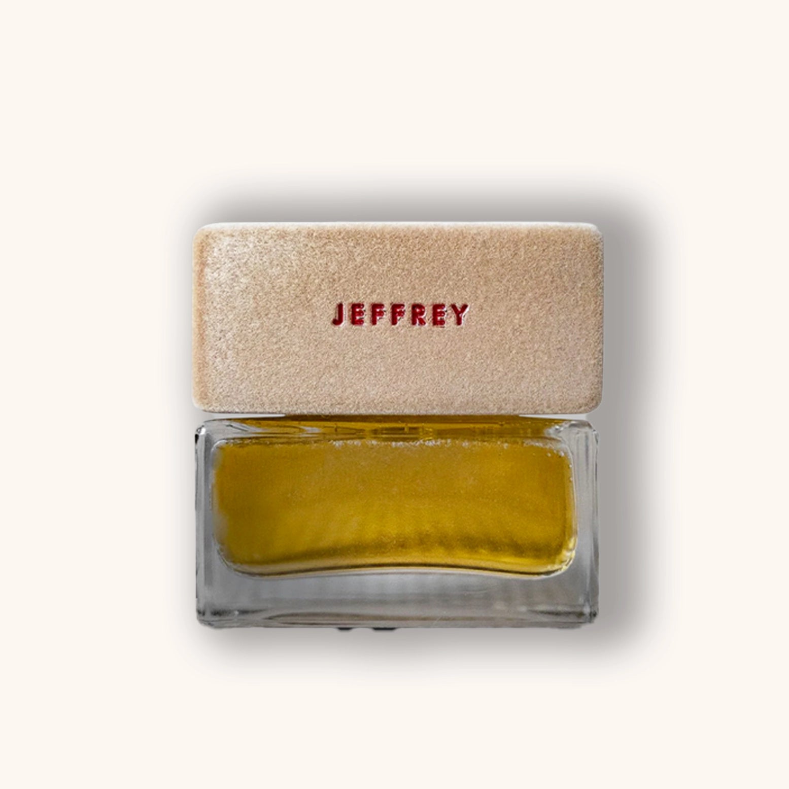 Small bottle with beige cap and yellow liquid on a white background
