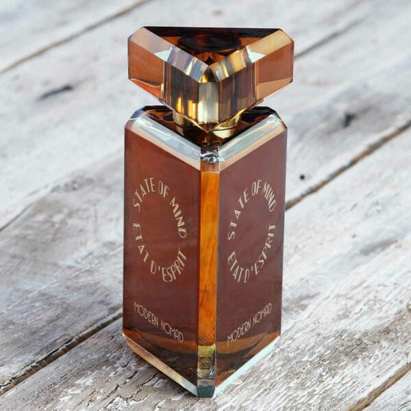 Promo shot of a bottle of perfume of State of Mind Modern Nomad