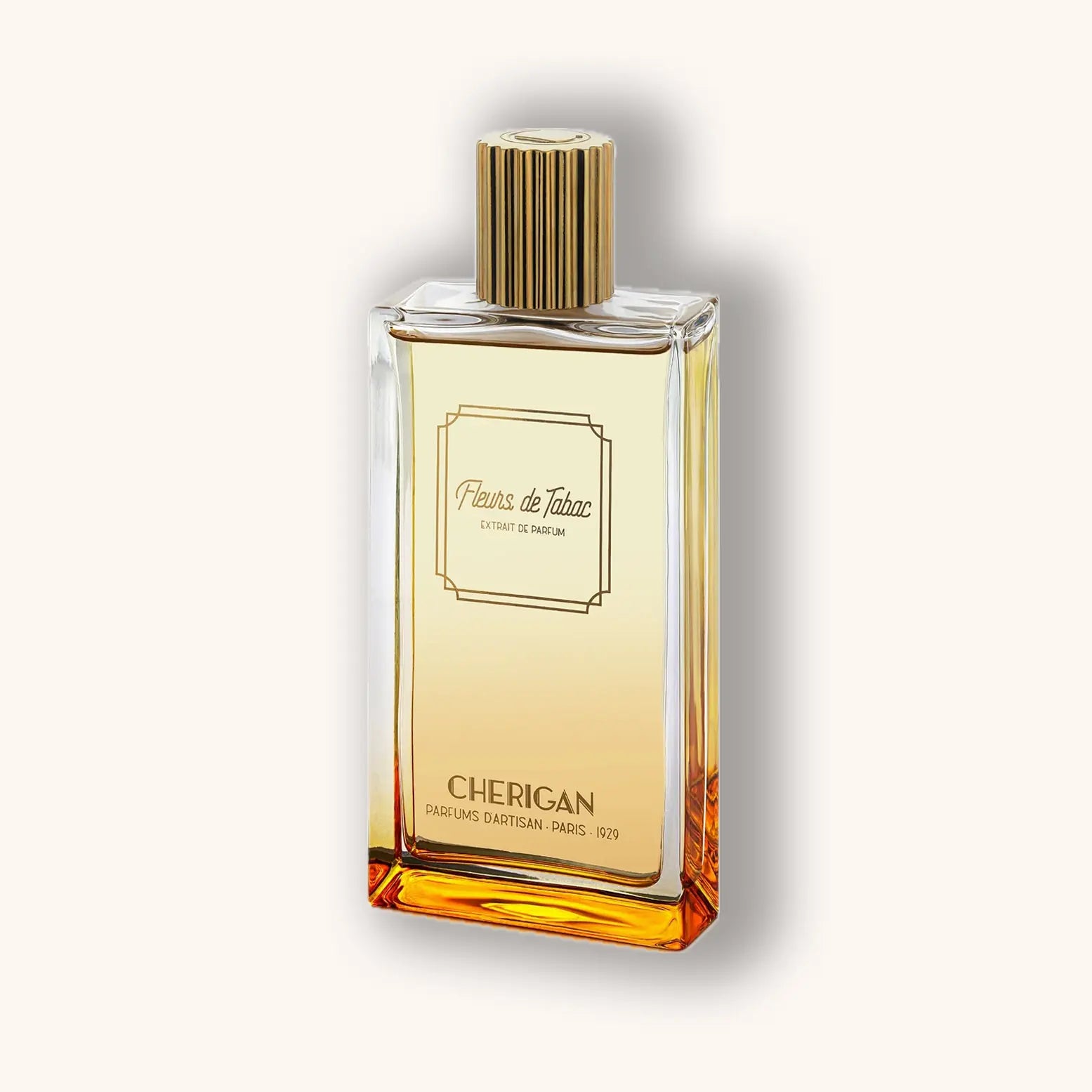 Alt text: A sleek glass bottle of Cherigan Fleurs de Tabac fragrance, featuring a gold cap and elegant label that conveys a sense of luxury and sophistication. The liquid inside has a warm, amber hue.