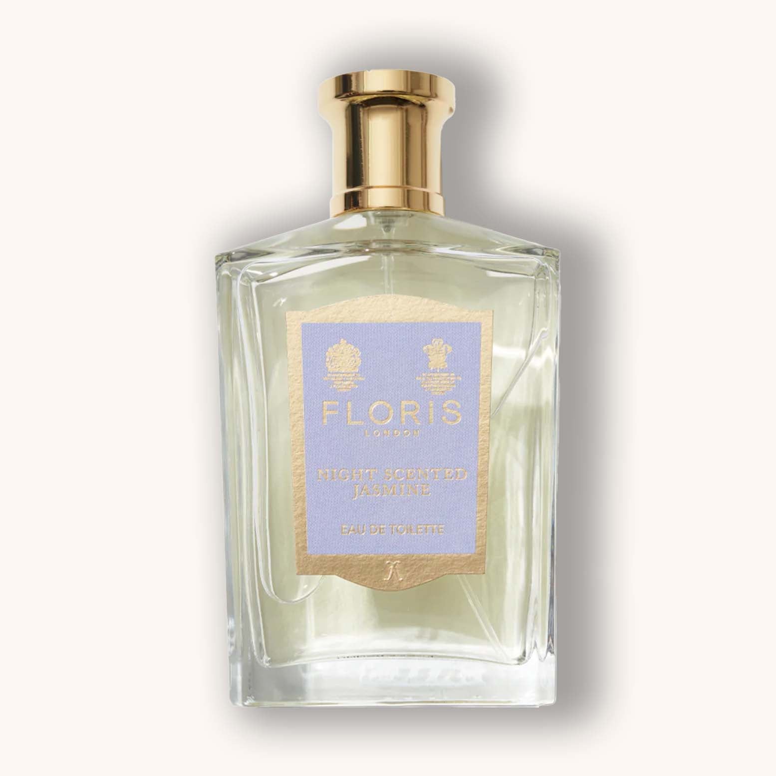Alt text: A stylish glass bottle of Floris London Night Scented Jasmine Eau de Toilette, featuring a pale blue label with gold accents. The fragrance is known for its floral, aromatic notes inspired by jasmine blossoms.