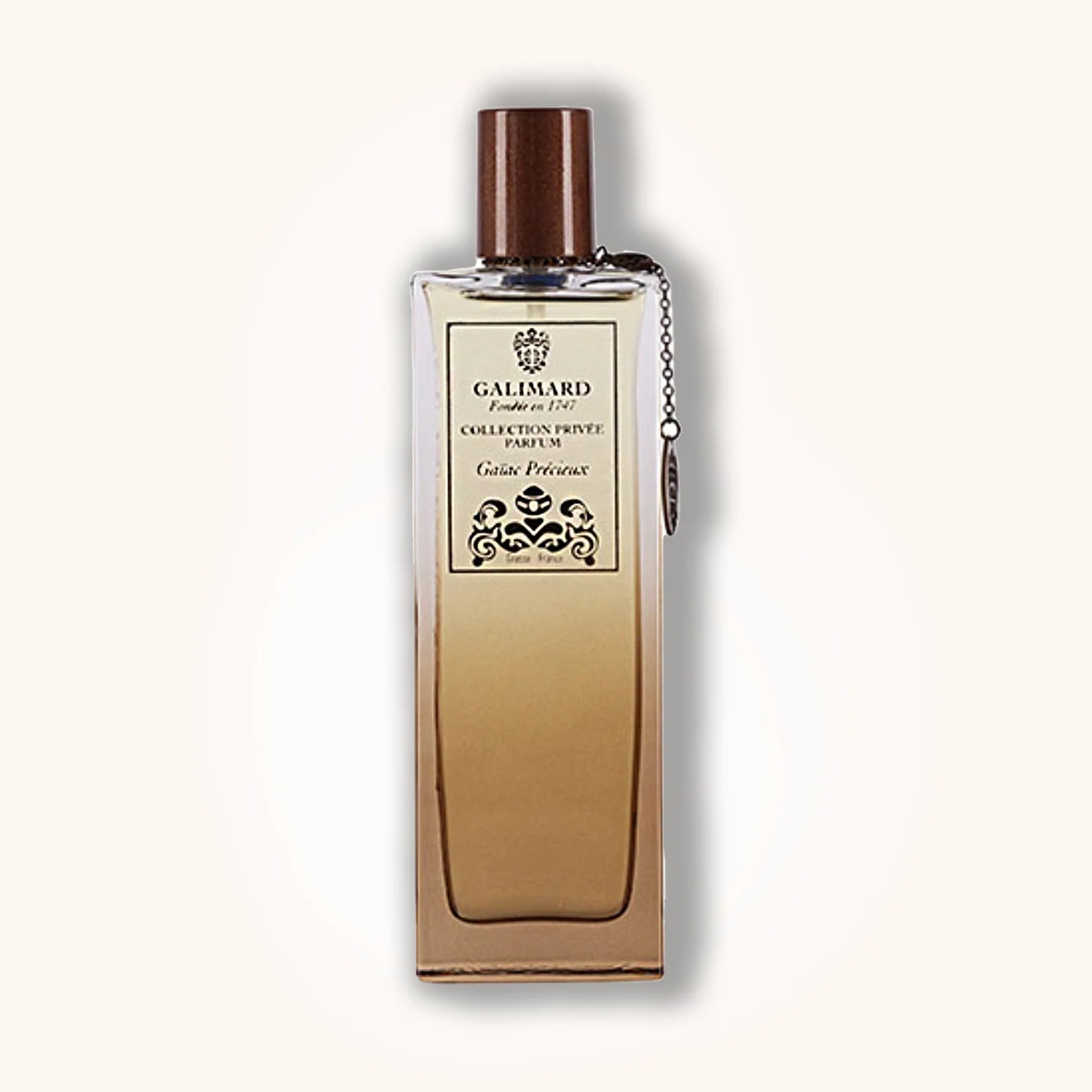 Galimard Gaïac Précieux in a beige-brown gradient bottle with signature Collection Privée design and elegant wood-colored cap.