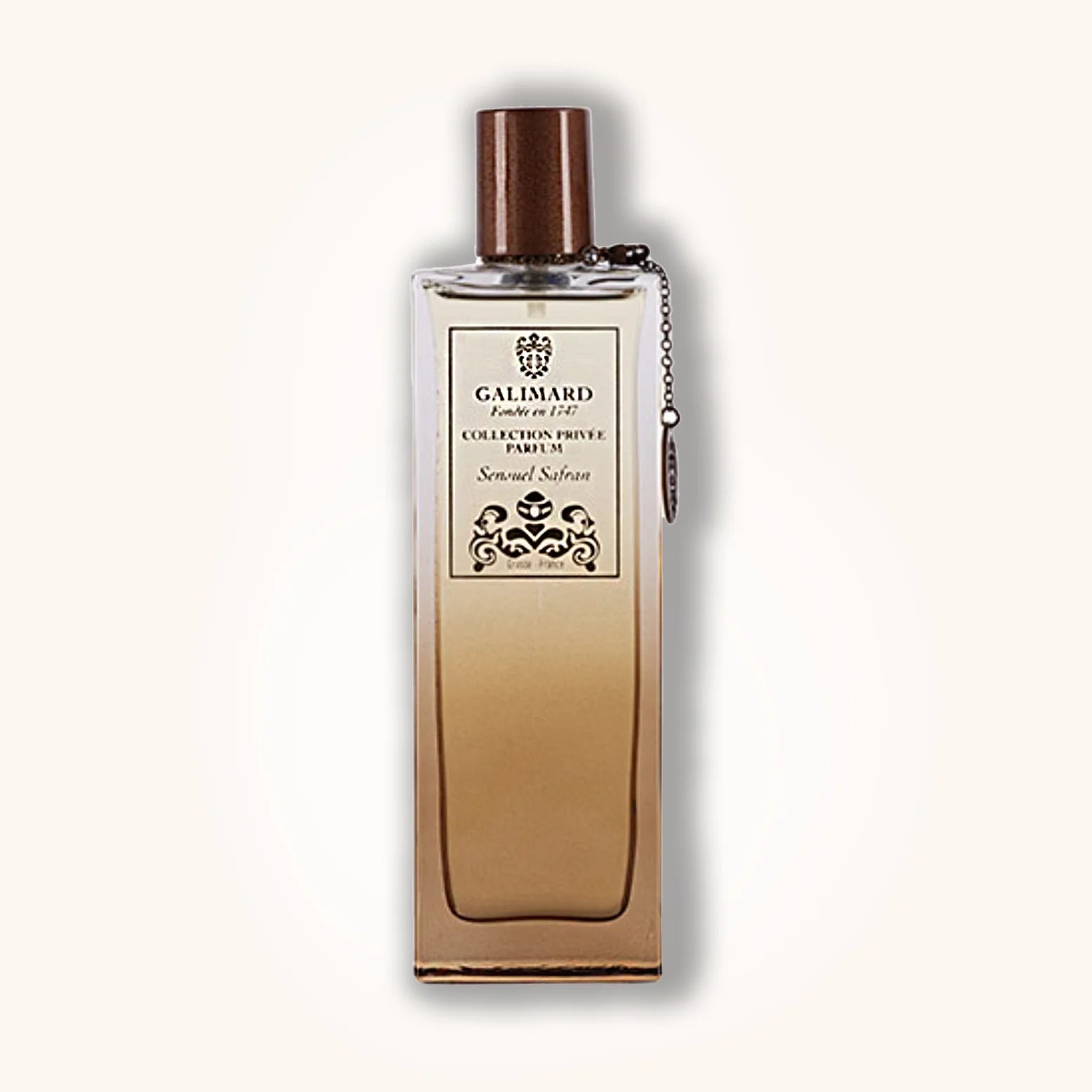 Galimard Sensuel Safran perfume in a gradient glass bottle with rich amber tones and brown cap from the Collection Privée line.