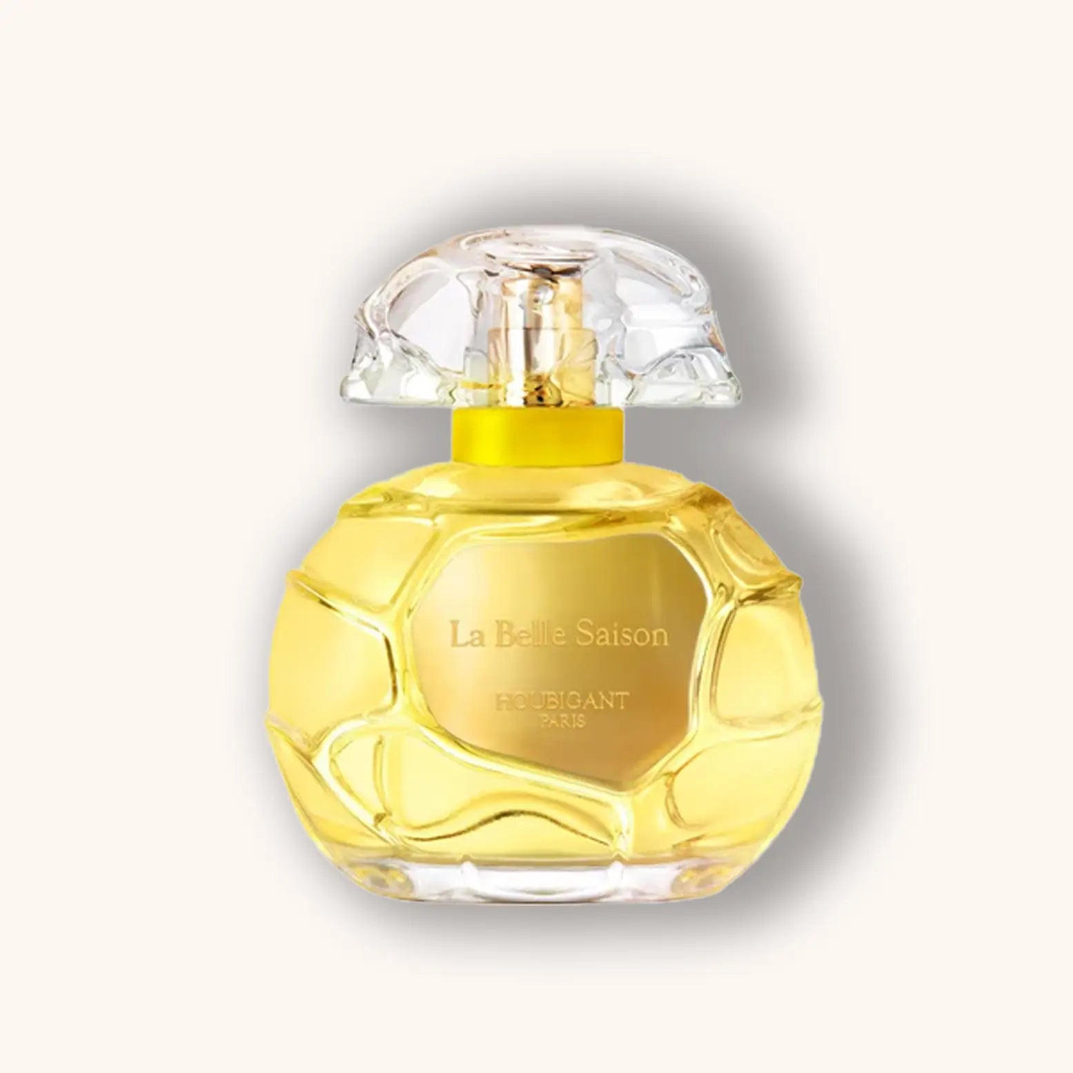 Perfume bottle labeled 'La Belle Saison' on a light gray background