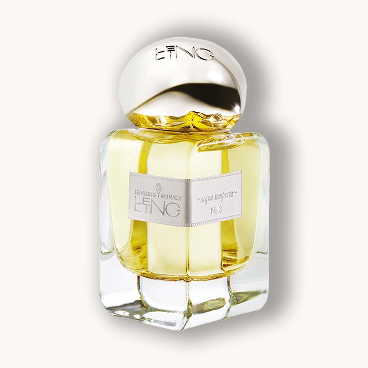 Alt text: A clear glass bottle of Lengling No 3 - Acqua Tempesta perfume, featuring a sleek design and a golden cap, with a label displaying the fragrance name.
