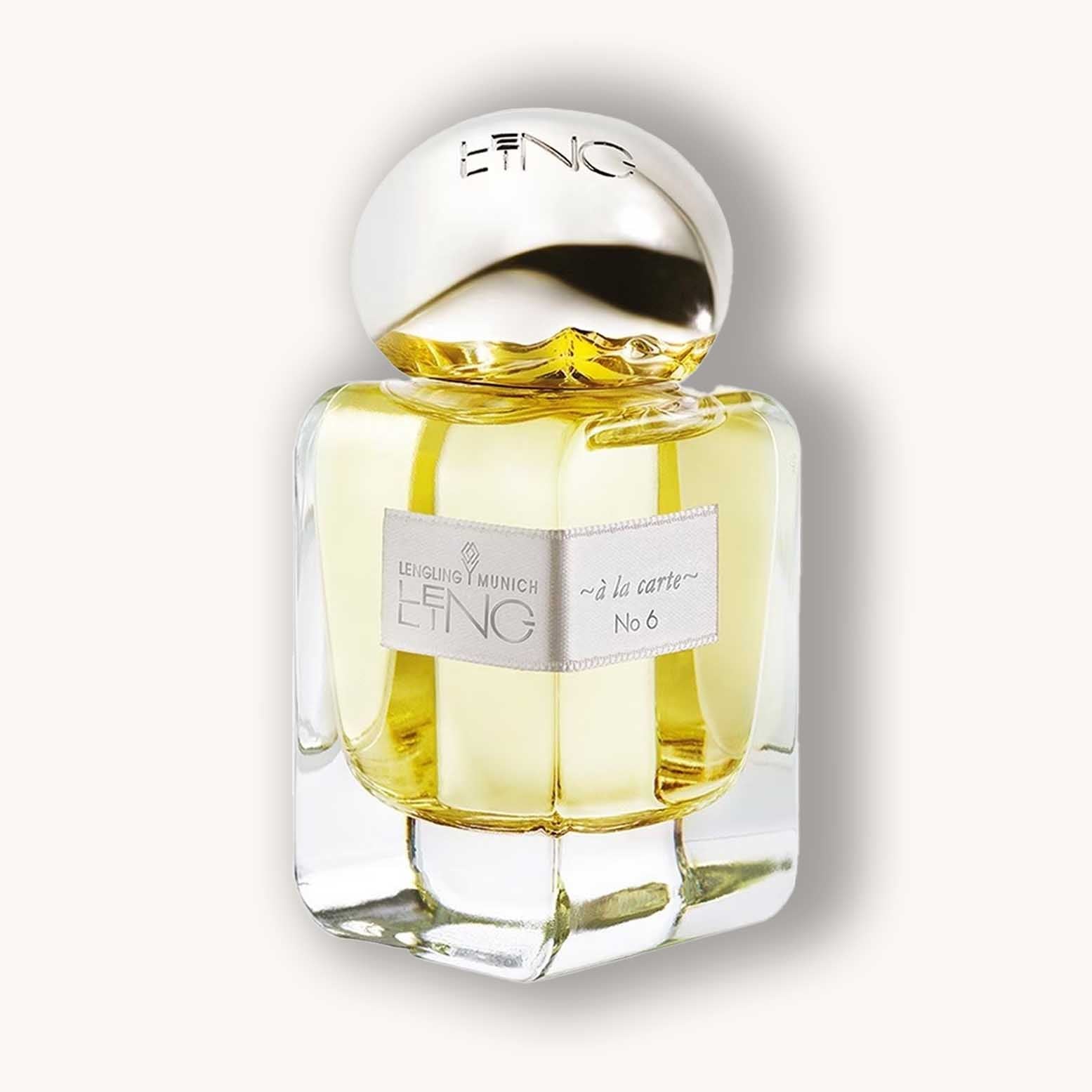 Alt text: A beautifully designed bottle of Lengling No 6 - A La Carte perfume, featuring a golden liquid and an elegant, rounded cap atop a clear glass base. The label highlights its unique name and luxurious appeal.