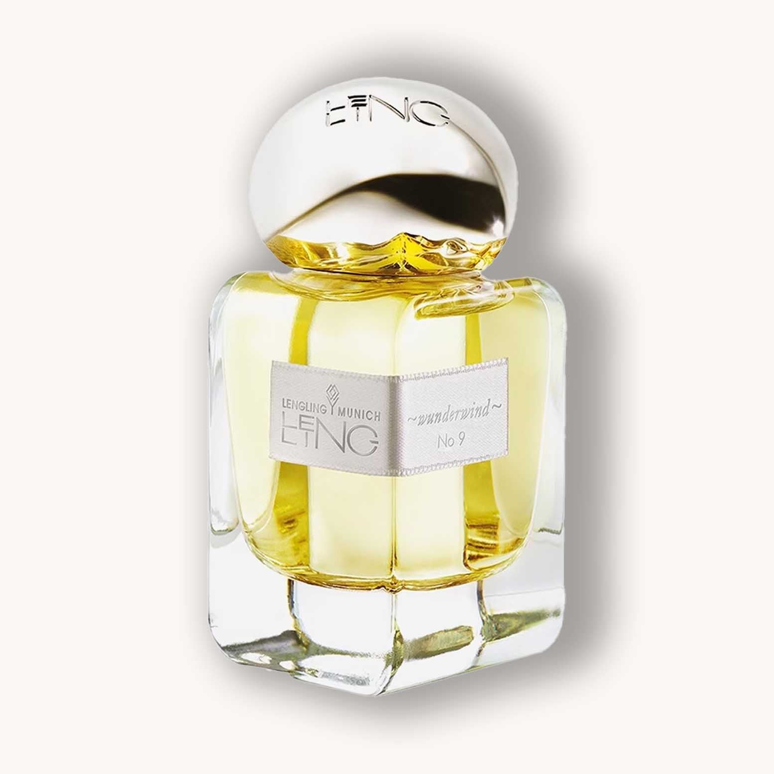 Alt text: "Bottle of Lengling No 9 - Wunderwind perfume, featuring a sleek glass design with a gold cap, showcasing its golden fragrance inside."