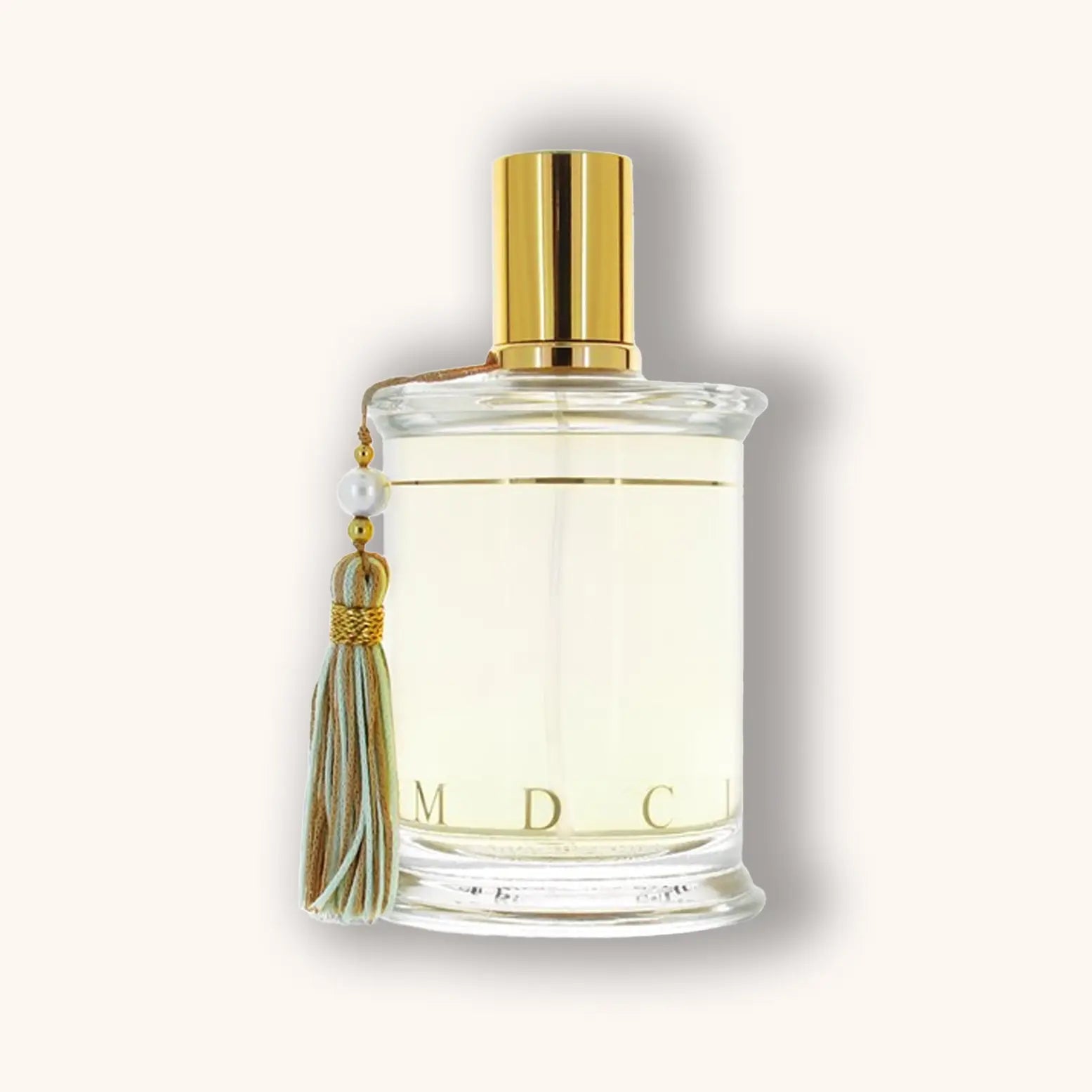 Bottle of MDCI Invasion Barbare perfume with a light golden liquid and pastel green tassel.