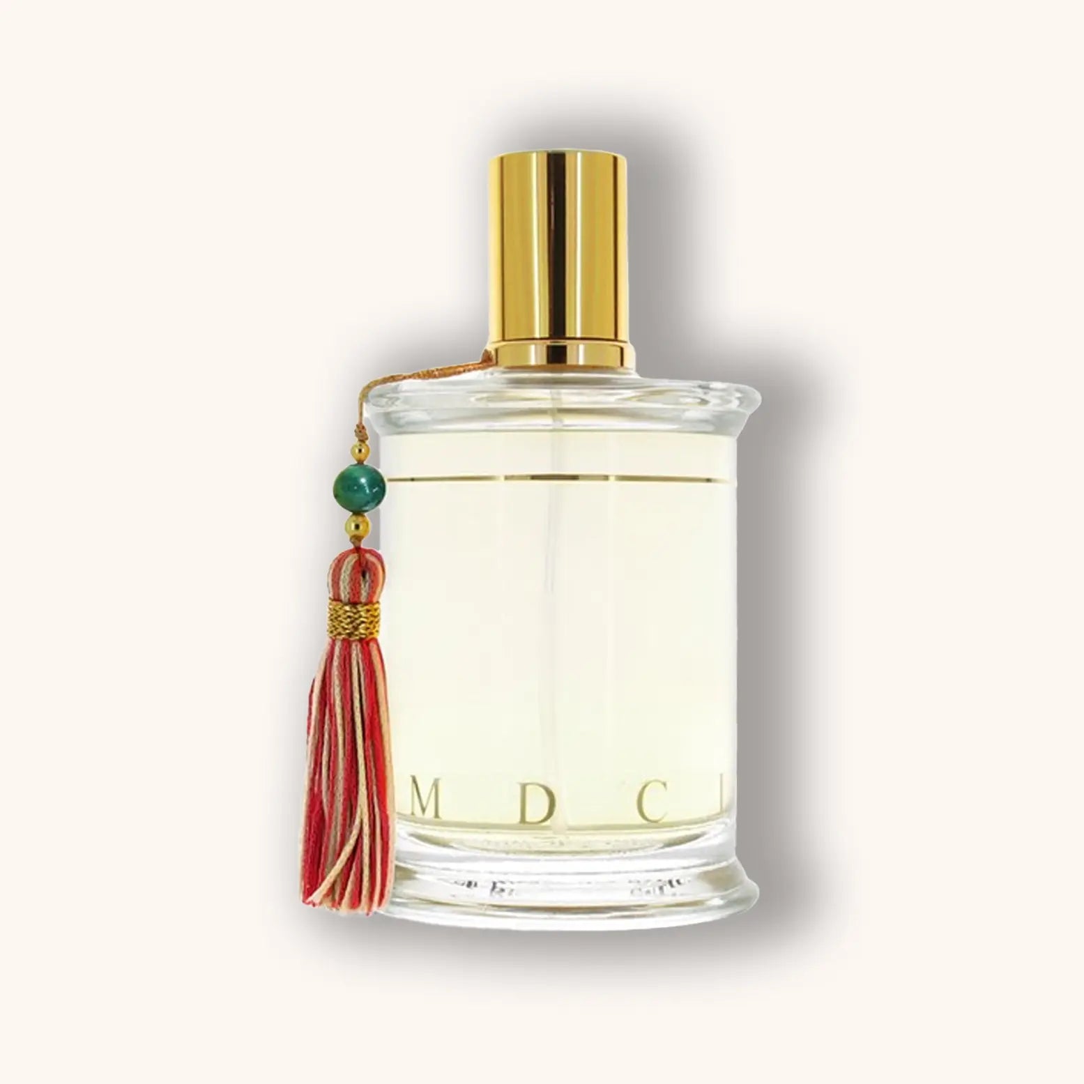 Bottle of MDCI Le Barbier de Tanger perfume with a clear liquid and red-green tassel.
