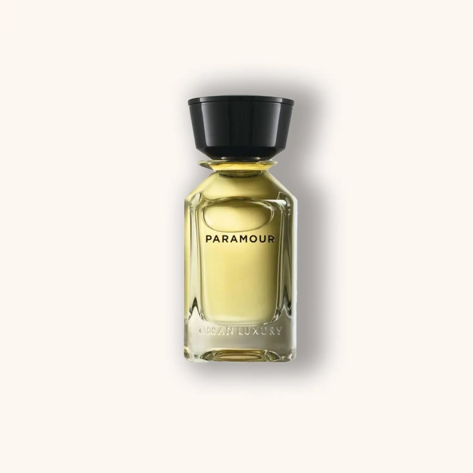 Alt text: A sleek glass bottle of Omanluxury Paramour perfume, featuring a minimalist design with a black cap and elegantly embossed branding. The golden liquid inside glimmers softly, suggesting luxury and sophistication.