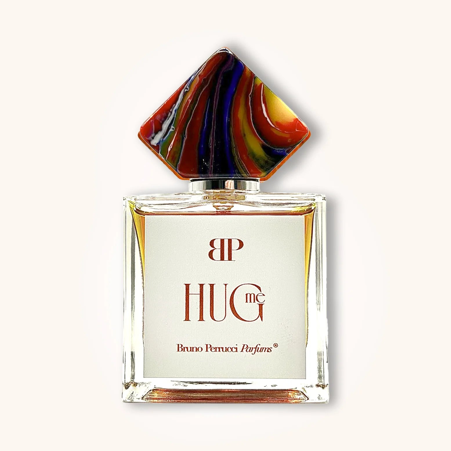 Hug Me by Bruno Perrucci Parfums in a clear glass bottle with a vibrant multicolored diamond-shaped cap and minimalist white label.