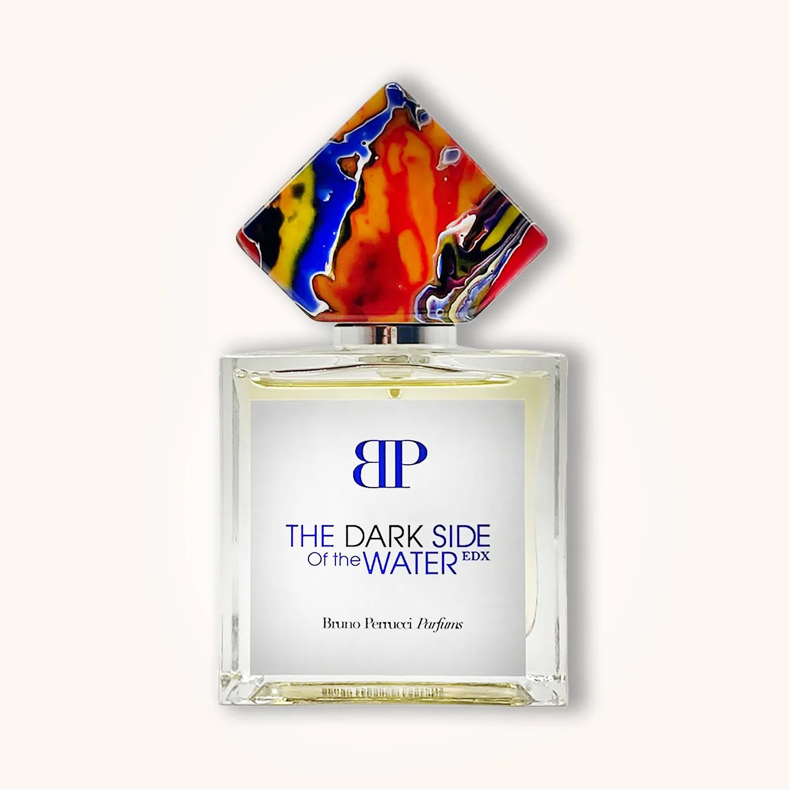A stylish bottle of Bruno Perrucci The Dark Side Of The Water fragrance, featuring a distinctive, colorful geometric cap and a clean, elegant design. The label prominently displays the perfume's name in bold lettering.