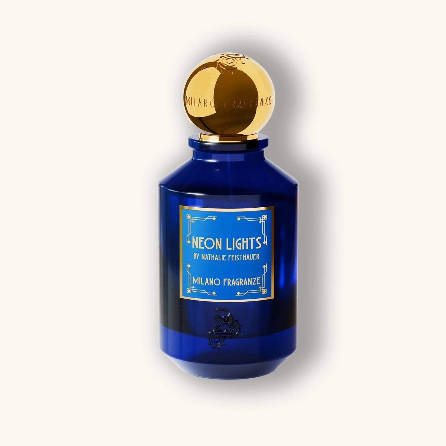 Blue perfume bottle with gold cap on a white background